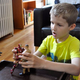Given the wild inconsistencies in the child’s plot, onlookers are unsure whether Iron Man and John Cena are facing off against one another here or discussing a possible tag-team strategy against a shared enemy.